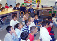 Children listening to Pastor McCubbins